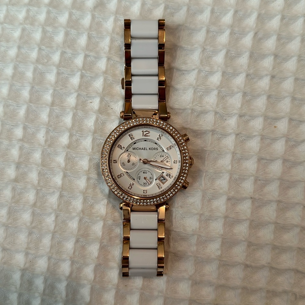 Micheal Kors rose gold and white watch